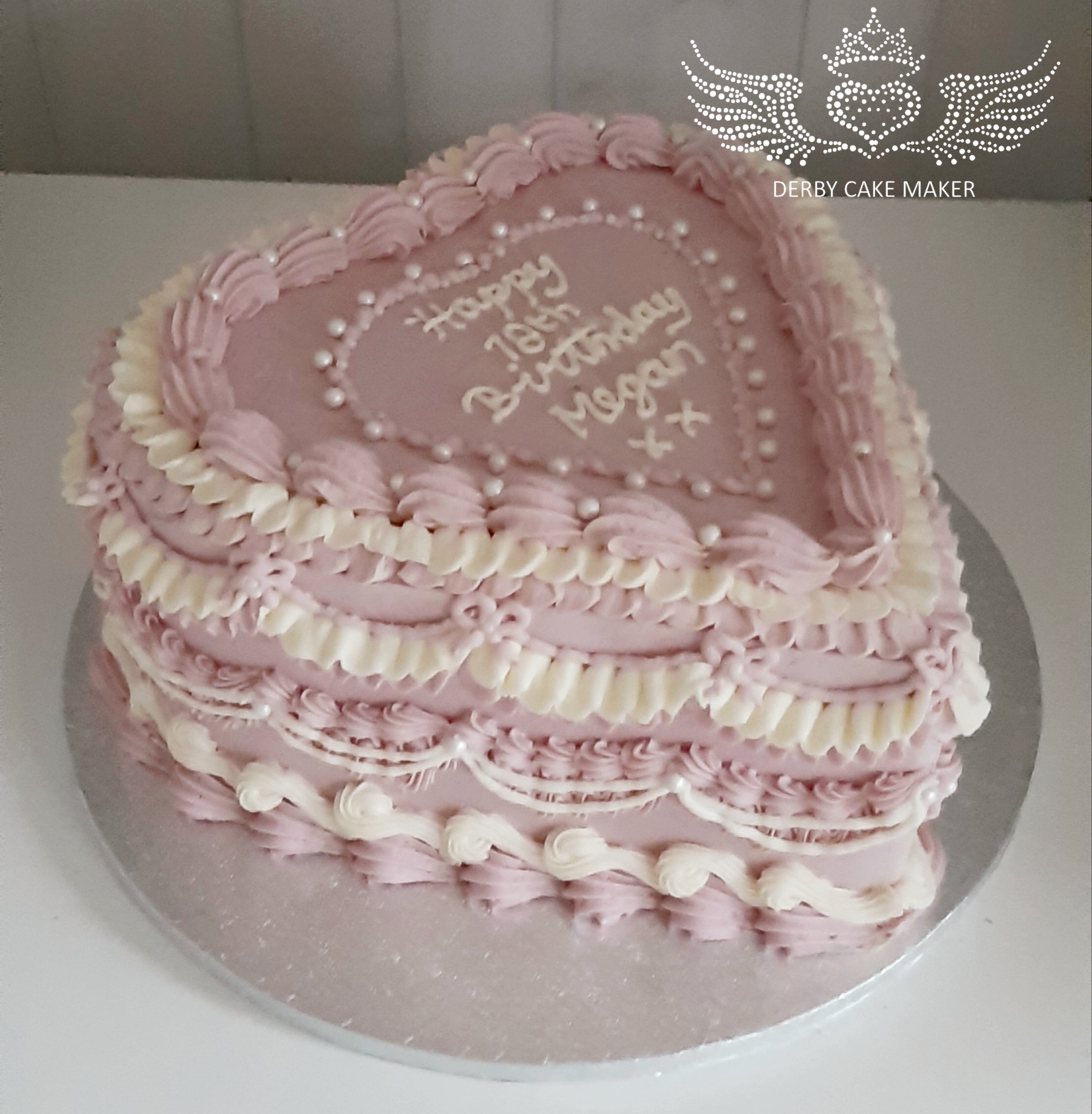 piped heart cake
